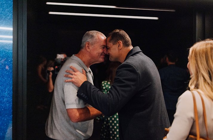Two men greeting each other during the  private guided tour led by a former All Blacks legend