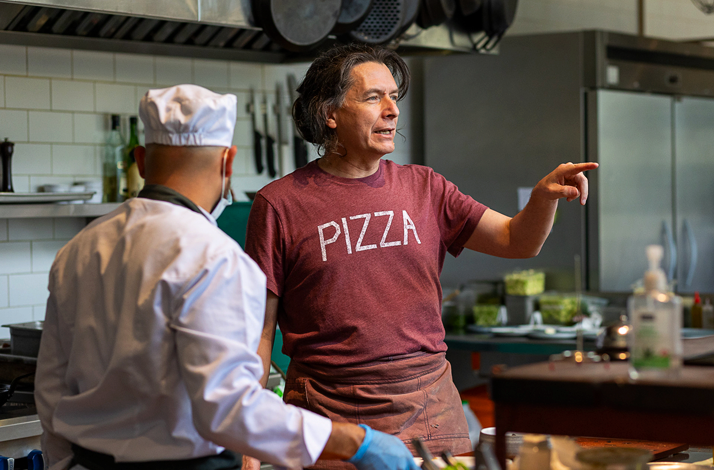 Chef Mario Rosero guiding participants in a professional kitchen
