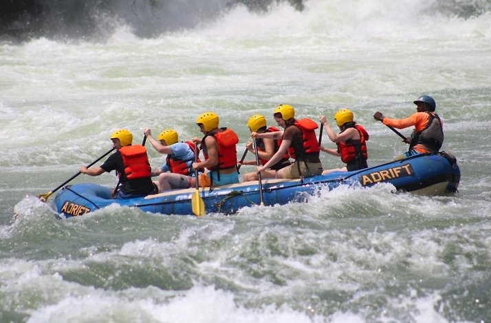 Group of rafters navigating white-water rapids on the Nile River in Jinja, guided by an expert crew.