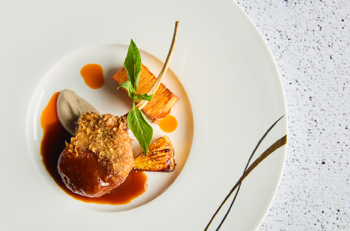 A gourmet plated dish at The Cavern restaurant.