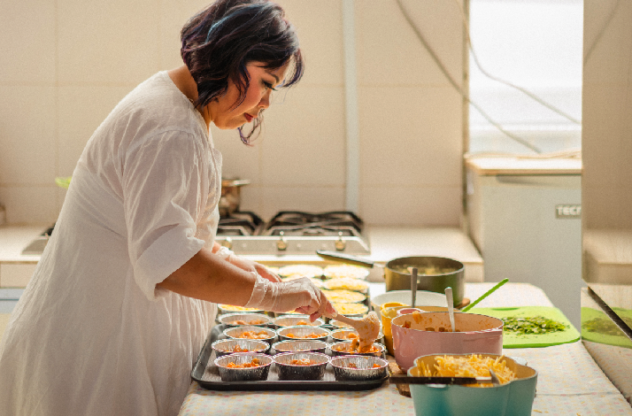 Sophia Yeow in  the process of cooking 