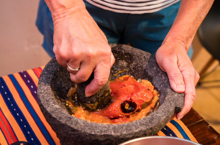Traditional molcajete used to prepare vibrant, handmade salsa.