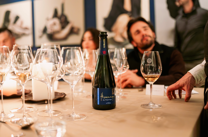 Bottle and wine glasses set for a guided climate-focused wine tasting.
