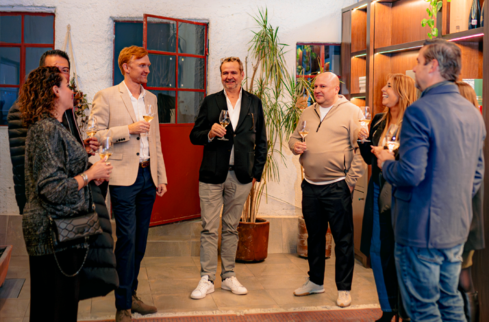 Guests sharing wine and conversation during an exclusive guided tasting.