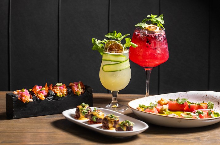 Glasses of cocktail accompanying snacks served at Stock & Barrel restaurant.