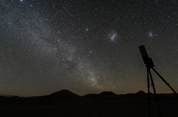 A telescope in the Atacama Desert with beautiful stars in the background.