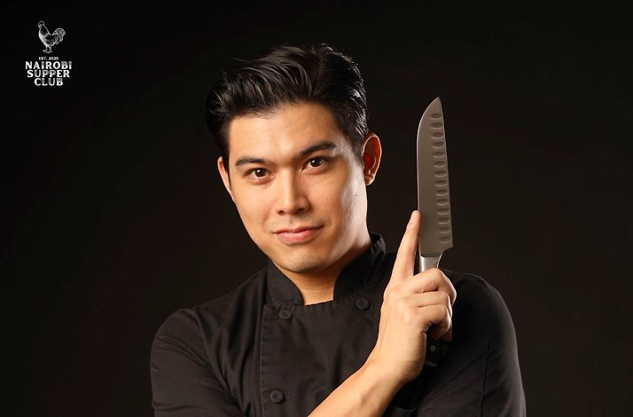 A chef wearing a black apron and holding a santoku knife. Nairobi Supper Club is displayed in a corner.