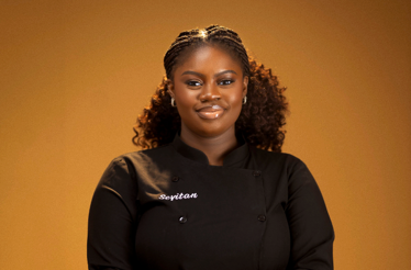 Chef Sevitan in a black embroidered chef's coat, pictured as guest chef for the Nairobi Supper Club event.