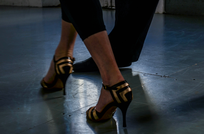 Close-up of woman’s feet in tango shoes.