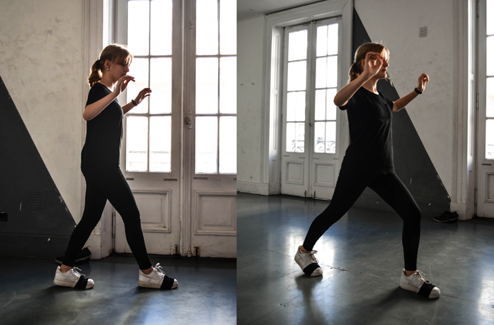 Woman in black outfit practicing fundamental tango steps during private tango session in San Telmo, Buenos Aires, Argentina.