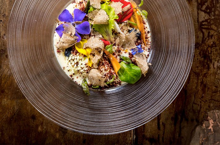Gourmet Umbrian dish with truffle and edible flowers served in Restaurant Trippini.