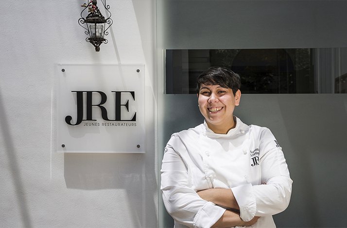 Chef Martina Caruso at the Restaurant Signum, Salina, with JRE sign..