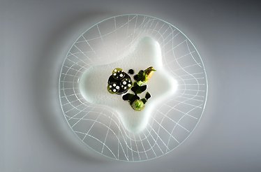 Fine dining dish served at three-Michelin-starred restaurant Enrico Bartolini al Mudec.