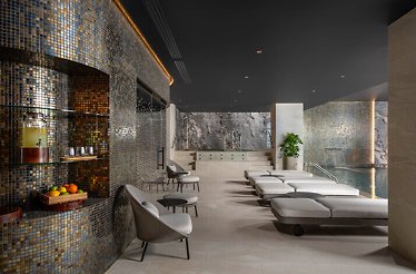 Pool area with chaise-longues at the Spa InterContinental Athénée Palace, Bucharest, Romania.