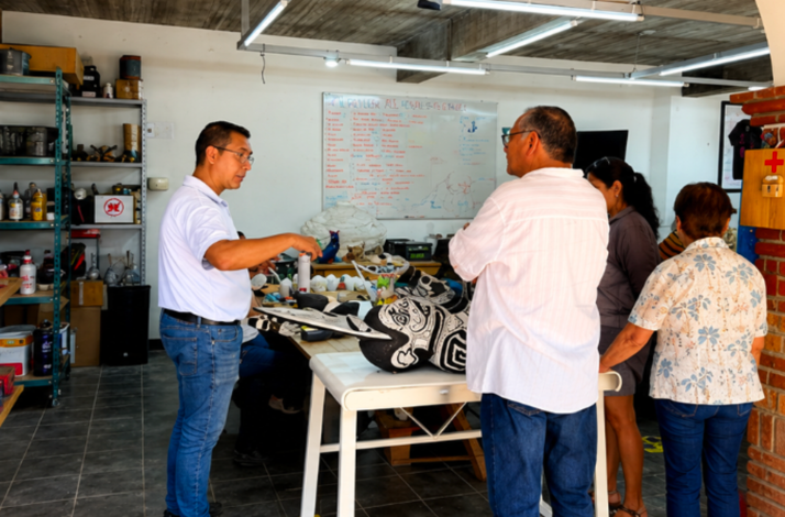Artisans explaining traditional Zapotec tonas and nahuals during an interactive studio tour.