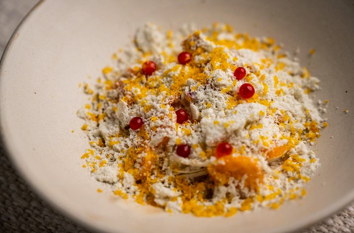 Afluente - Plated course dusted with grated leaf cheese and cassava