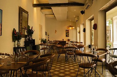Carmen - Main dining room in the restored colonial home, with terracotta leather chairs