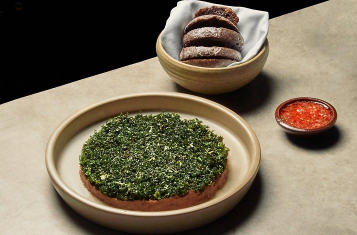 Oda restaurante Bogota — contemporary Colombian plated dish with herb crust, house bread and salsa