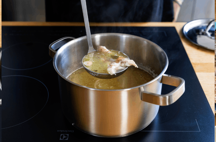 A ladle of freshly cooked Dalmatian fish soup.