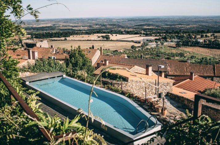Aerial view of the swimming pool at Casa da Cisterna in the Castelo Rodrigo region.
