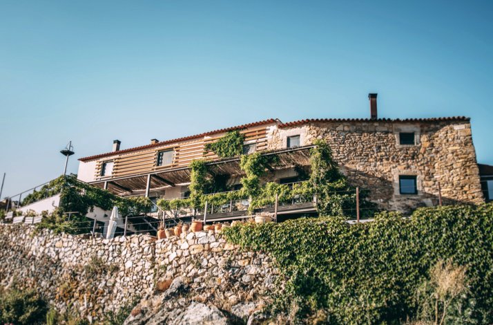 The exterior of Casa da Cisterna in the historic Castelo Rodrigo region.