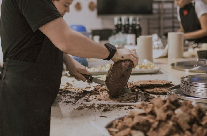 Cacao loaf sliced during tasting preparation.