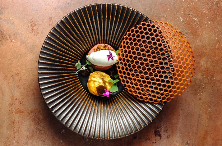 Artful gourmet appetizer with honeycomb presentation of Le  Panier