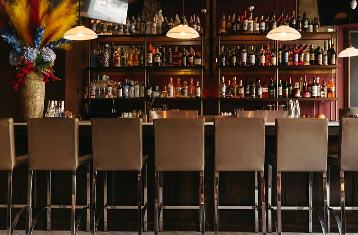 Bar counter at Piccolo Morini featuring collection of Italian wine.