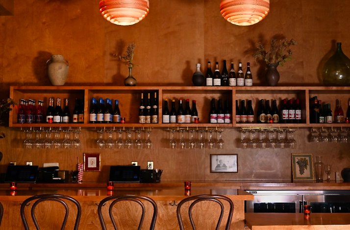 Bar counter at Ètra featuring collection of Italian wine.
