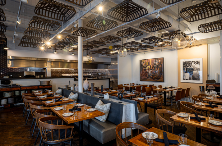Interior of Virtue Restaurant with tables served for guests.