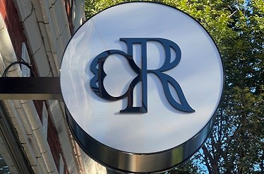 Cantina Rosa cocktail bar logo sign on the venue building.