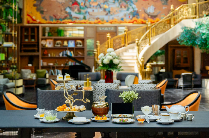 Afternoon tea spread displayed in a luxurious hotel lounge.