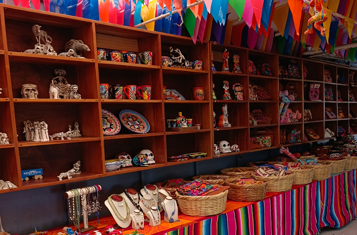 A Mexican market at Playa del Carmen featuring a variety of handcrafted souvenirs.