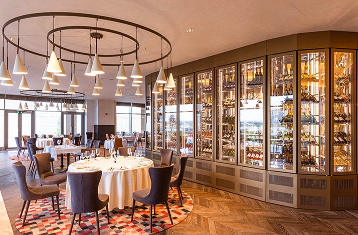 Dining interior design of Silk Road Samarkand, shawcasing drink cabinet display.
