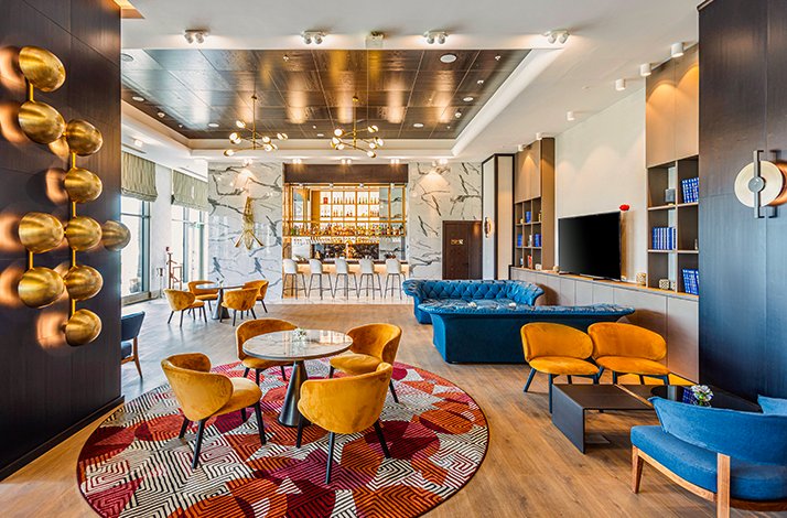 Modern lounge area of Silk Road Samarkand, showcasing bright colour furnitures.