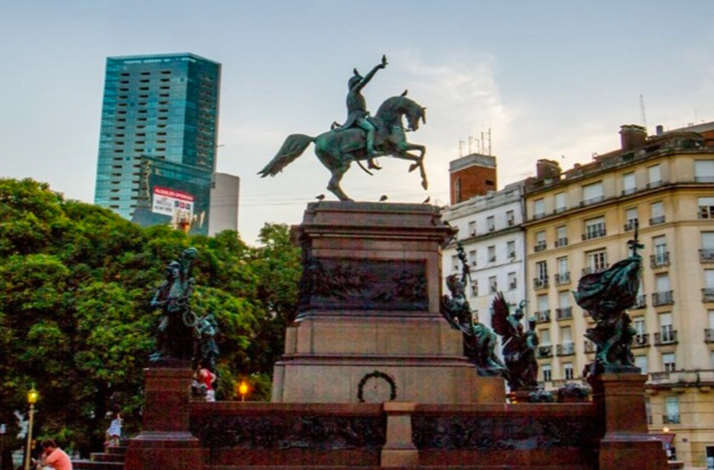 Equestrian monument in Buenos Aires surrounded by historic buildings, reflecting key moments in Argentina's past.