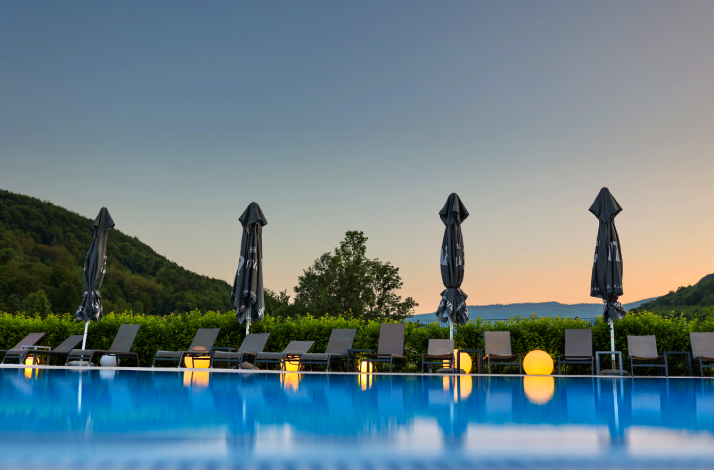Serene poolside lounge chairs at Camping Plitvice.