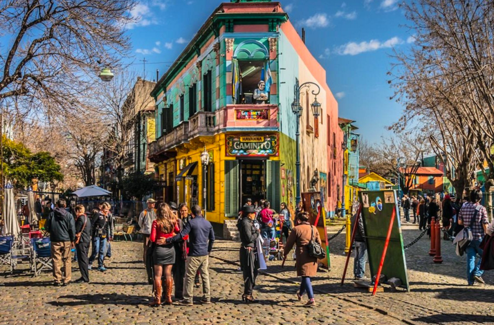 Travelers explore colorful Caminito in La Boca during a guided cultural experience in Buenos Aires.