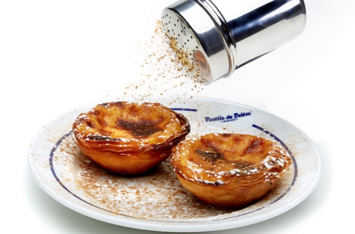 Sprinkles on top of a Portuguese pastry.