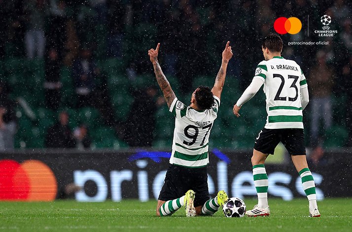 Suarez, No. 97, celebrating on knees with arms raised after scoring for Sporting CP in UEFA Champions League Round of 16.