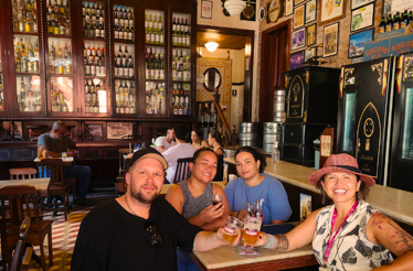 People enjoying the Tour with drinks in a bar in Rio.