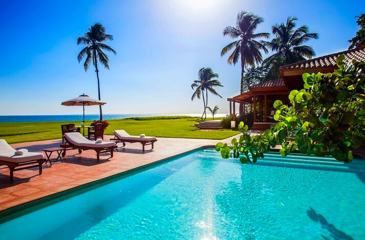 Casa de Campo resort, showcasing the swimming pool and lounging area. 