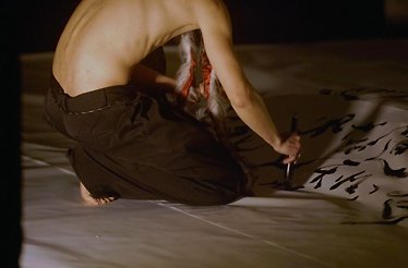 Artist Jiannyuh Wang performing Calligraphy Dance at The Feuerle Collection museum in Berlin, Germany.