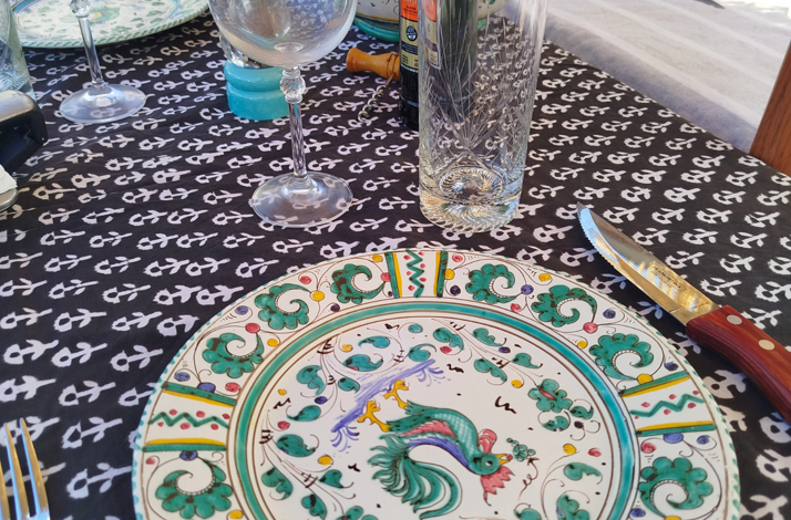 Elegant table setting prepared for a shared Argentine barbecue and wine experience.
