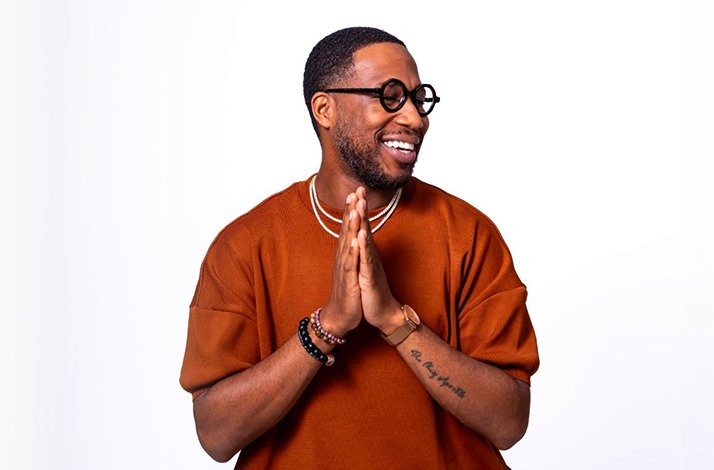 Promotional poster for Cory Henry standing in front of a white background.