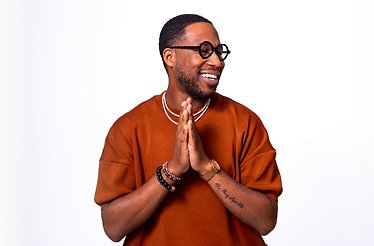 Promotional poster for Cory Henry standing in front of a white background.