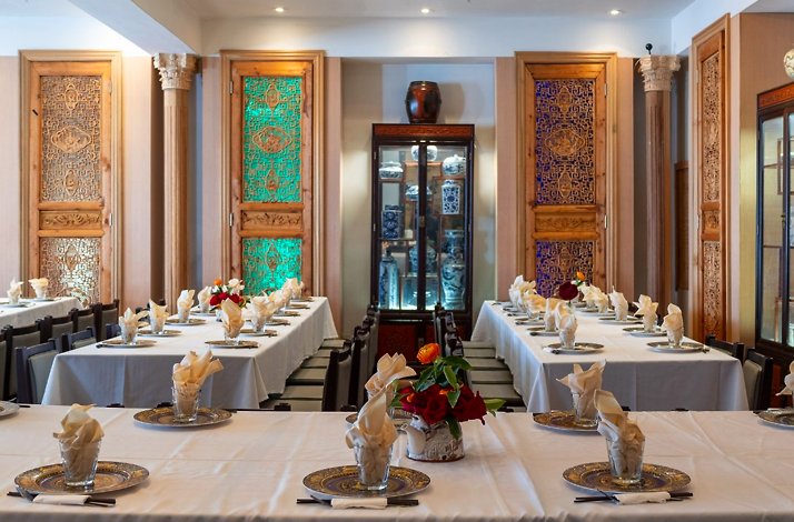 Elegant dining tables set for service inside the private dining room at Fang Restaurant in San Francisco.