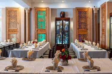 Elegant dining tables set for service inside the private dining room at Fang Restaurant in San Francisco.