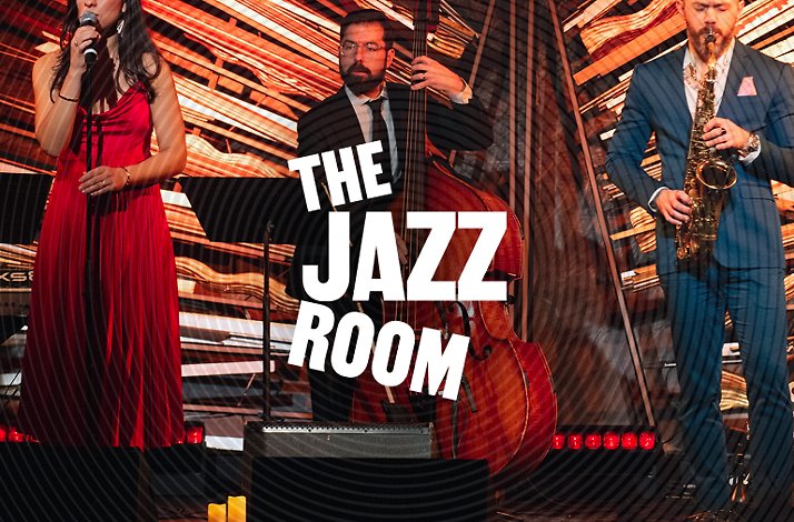 A live jazz band with a female singer, double bassist, and saxophonist performing under the words The Jazz Room.