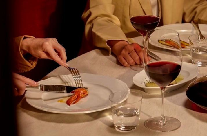 Close-up of diners enjoying appetizers at at Seia Miami.